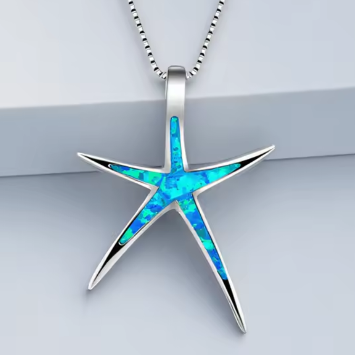 ANELLO A FASCIA CON GEMMA BRUMA DELL’OCEANO