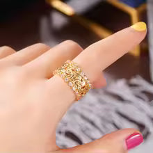 ANELLO INTRECCIATO DORATO CON ZIRCONIA