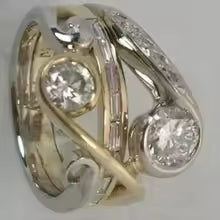 ANELLO DI LUSSO CON ZIRCONIA E METALLI MISTI