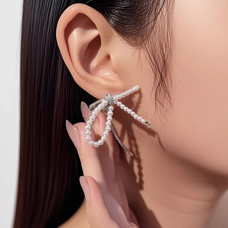 ORECCHINI IN ARGENTO STERLING CON PERLE E FIOCCO