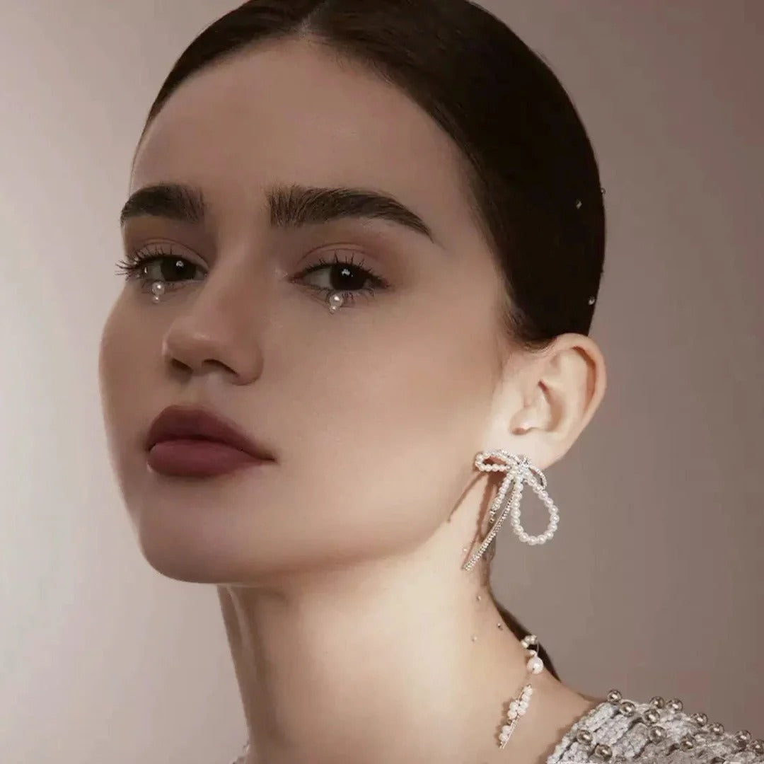 ORECCHINI IN ARGENTO STERLING CON PERLE E FIOCCO