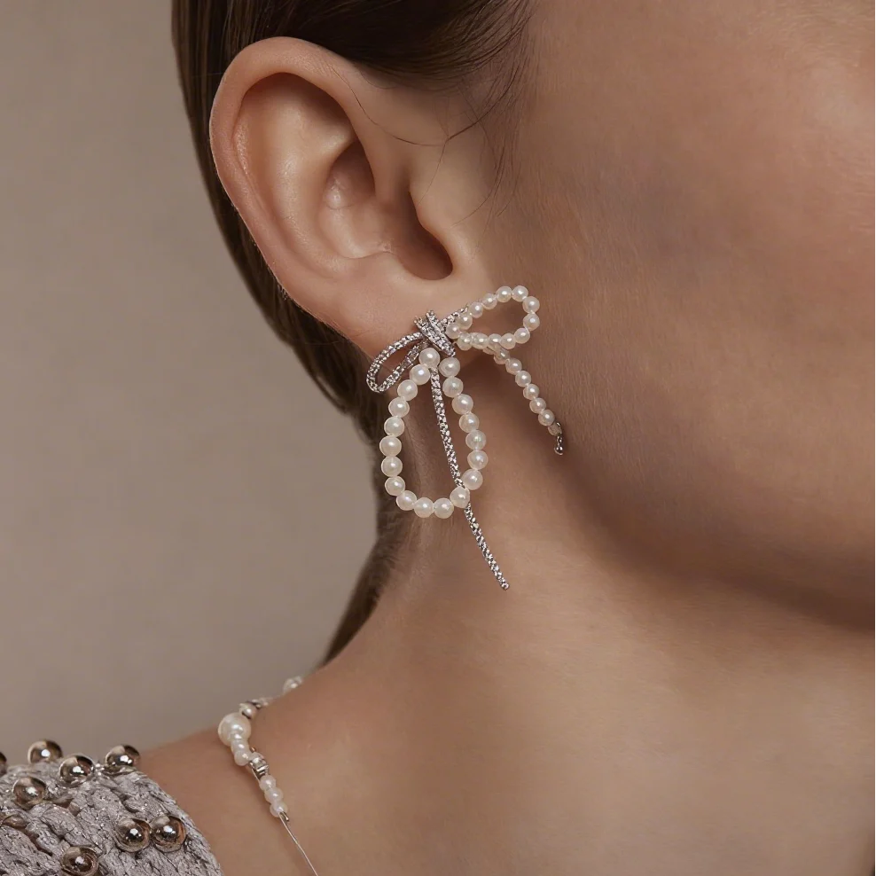 ORECCHINI IN ARGENTO STERLING CON PERLE E FIOCCO