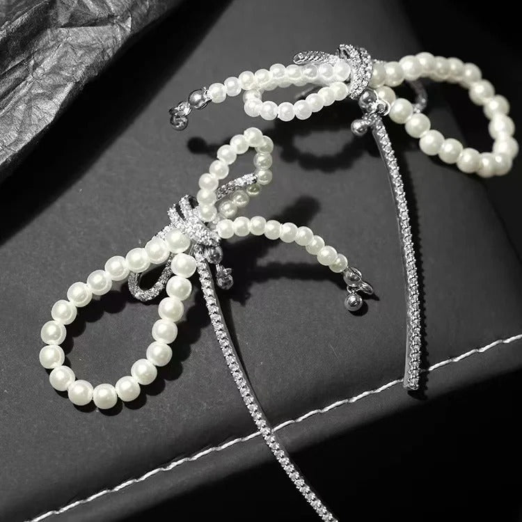 ORECCHINI IN ARGENTO STERLING CON PERLE E FIOCCO