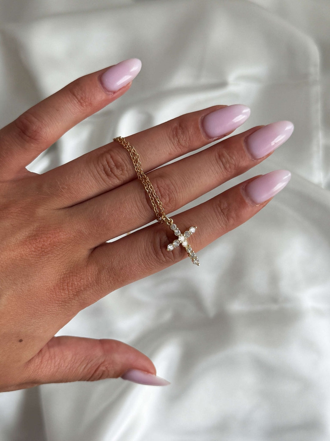 CIONDOLO CROCE DI LUCE CELESTE